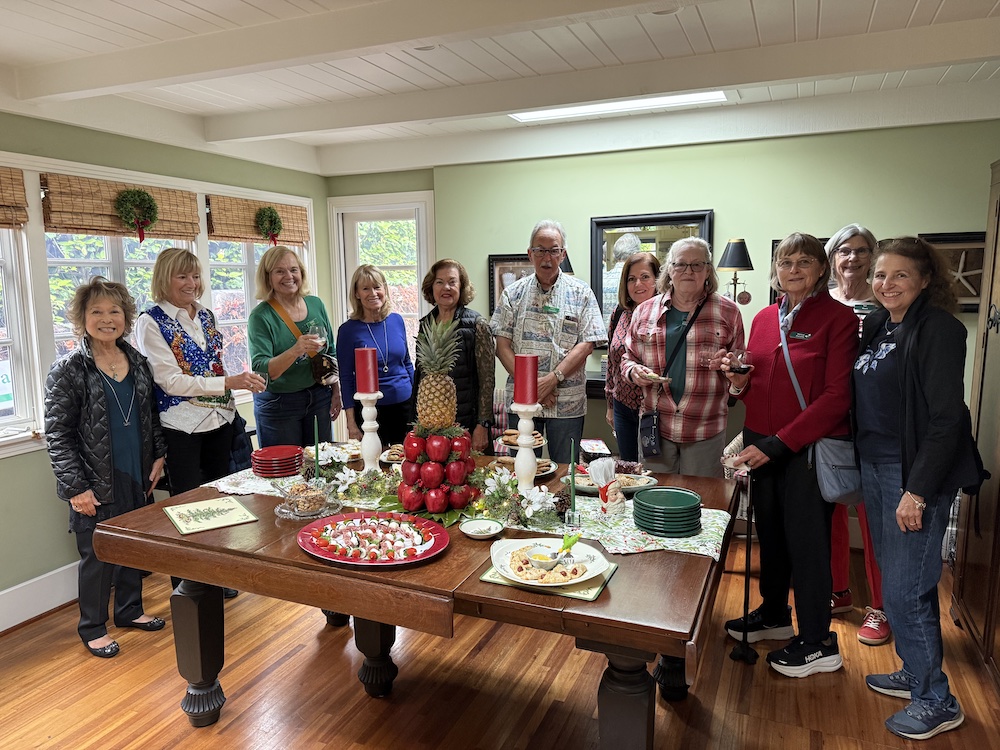 L Zeller grp indoor attendees Members enjoying the Holiday Member's Home Tour.