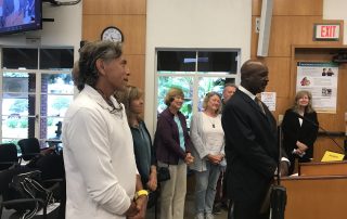 Reginal Christian receiving his Certificate of appreciation award at City Hall