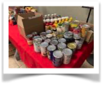 A table laden with our food drive donations