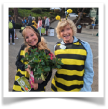 Jane and Dee in bee costumes at Arbor Day celebration