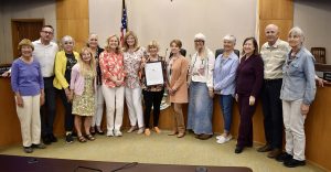 Members posing with certificate for Bee Day proclamation at Laguna Beach City Council meeting