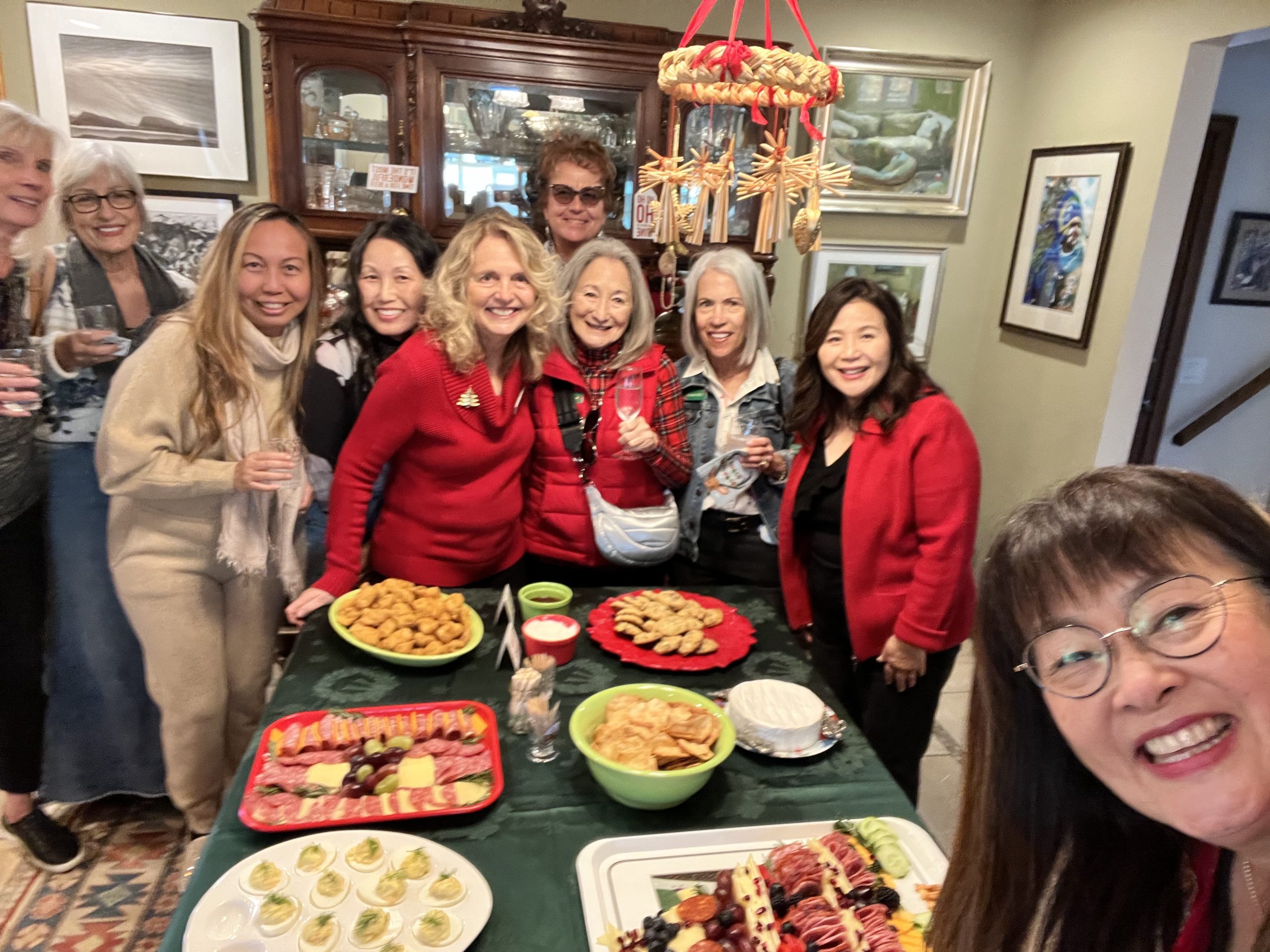 Visitors gather around a holiday spread at our Holiday Open House Tour