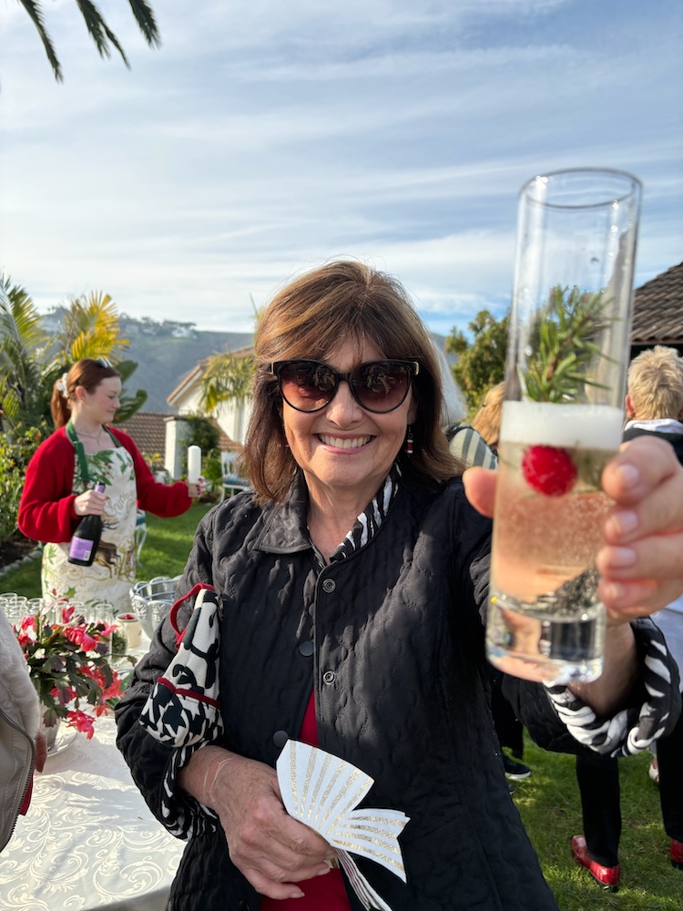 L Goodlad champagne greeting Home owner offers champagne
