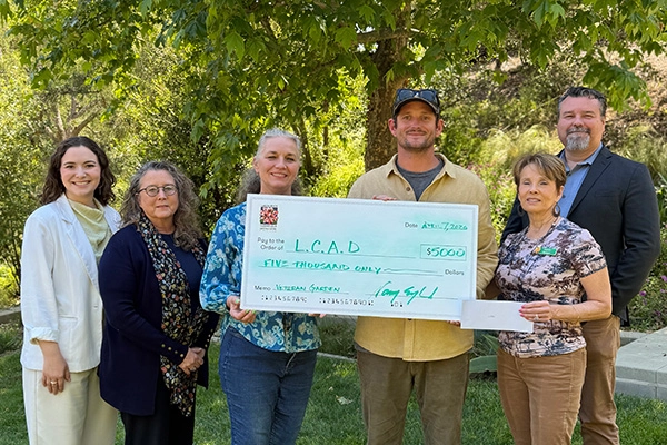 LCAD-check Club presents LCAD with a check